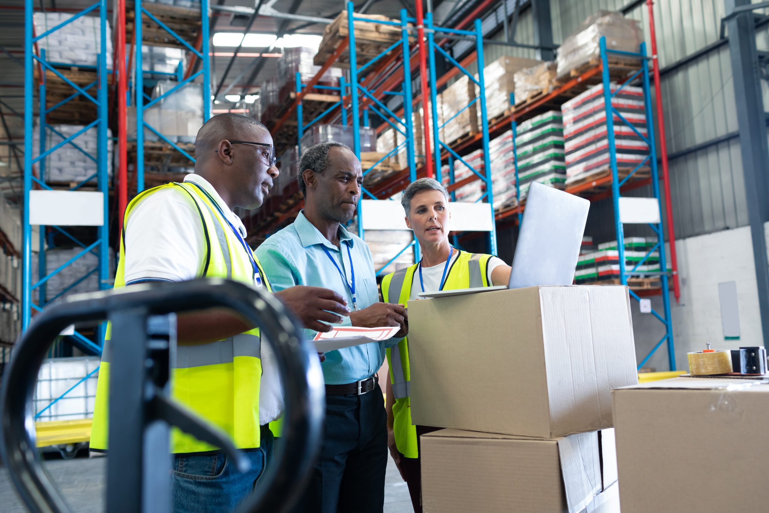 Izinga Technologies team in a warehouse discussing operations